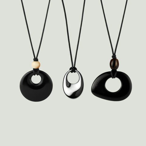 Handmade resort-style necklaces designed for easy layering and effortless holiday looks.